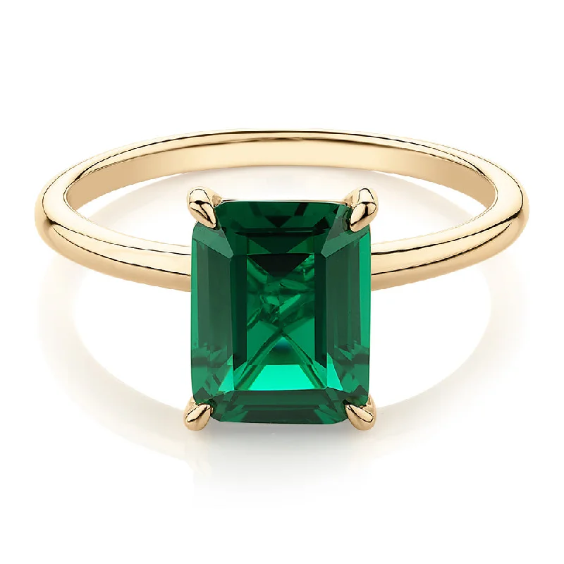 High-End Jewelry, Now More Affordable Than Ever Dress ring with emerald simulant in 10 carat yellow gold