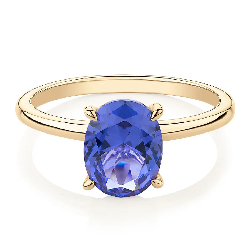 Huge Savings On Timeless Jewelry Collections Dress ring with tanzanite simulant in 10 carat yellow gold