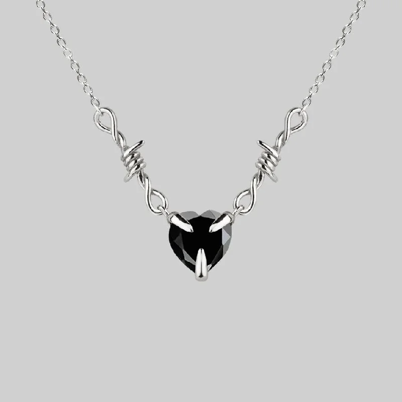 Fashion-Forward Geometric Jewelry For Contemporary Style FATAL. Barbed Wire & Black Onyx Heart Necklace - Silver