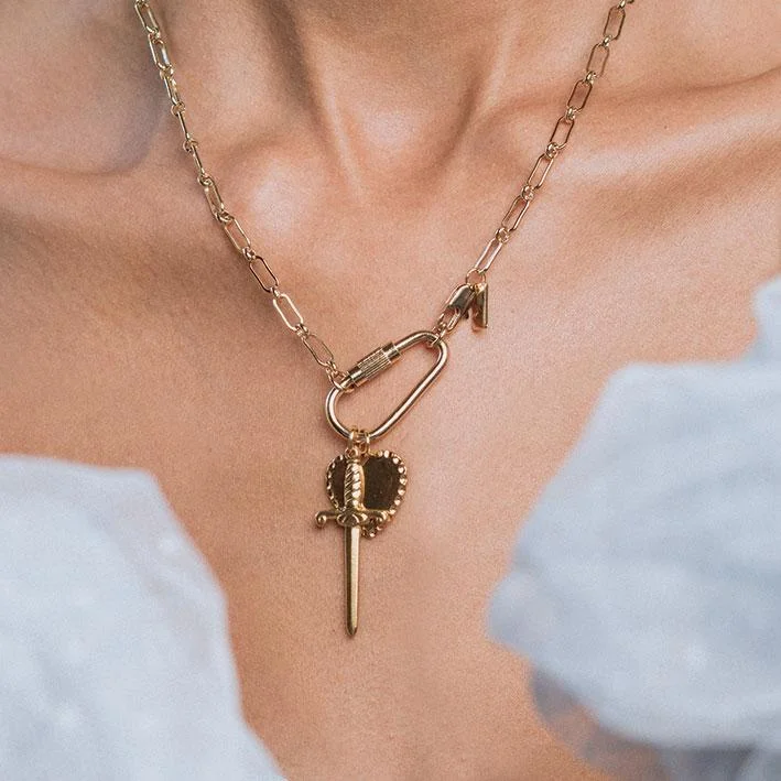 Discounted Luxury Jewelry – Shine Without The Splurge TORMENT. Heart & Dagger Carabiner Charm Necklace - Gold