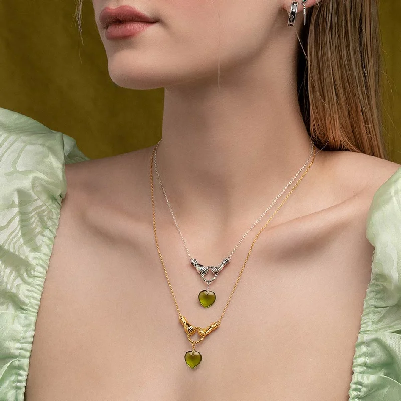 Affordable Elegance – Special Jewelry Sale Now Live UNITE. Hand Grasping Green Glass Heart Necklace - Gold